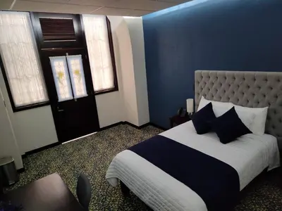 Cama o camas de una habitación en HOTEL MARGARITA