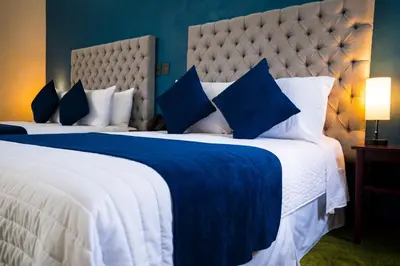 Cama o camas de una habitación en HOTEL MARGARITA