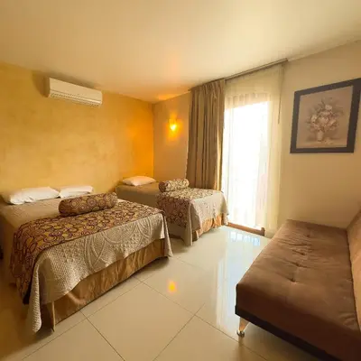Cama o camas de una habitación en Quinta Roca Hotel