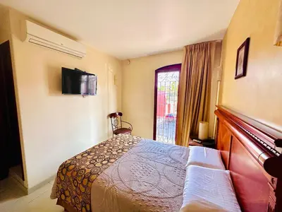 Cama o camas de una habitación en Quinta Roca Hotel