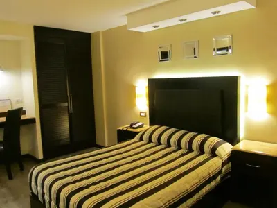 Cama o camas de una habitación en Hotel Colonial