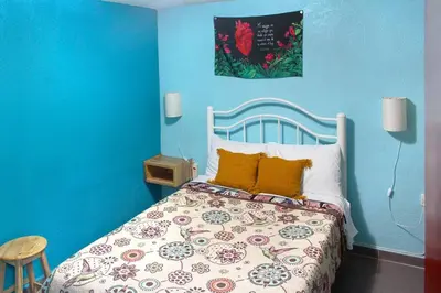 Cama o camas de una habitación en Colorida Casa Azul en Texcoco Centro WiFi Cocina