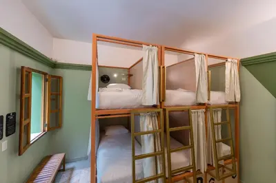 Cama o camas de una habitación en Viajero Oaxaca Hostel