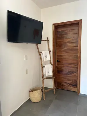 Una televisión o centro de entretenimiento en Mare mío Hotel Boutique