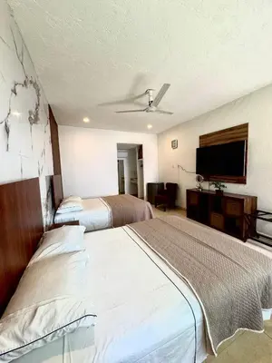 Cama o camas de una habitación en Hotel Boutique Luciérnaga Xochitepec