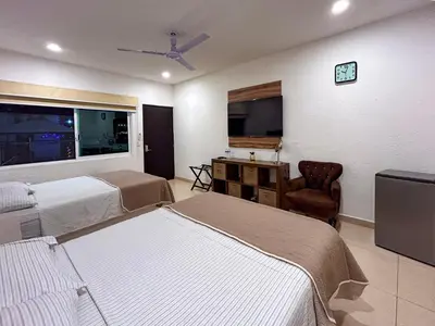 Cama o camas de una habitación en Hotel Boutique Luciérnaga Xochitepec