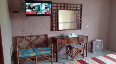 Una televisión o centro de entretenimiento en Hotel Angela Carolina