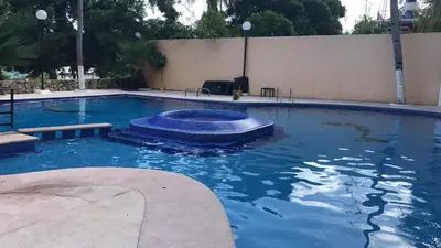 Piscina en o cerca de Departamento con vista al mar, albercas y juegos