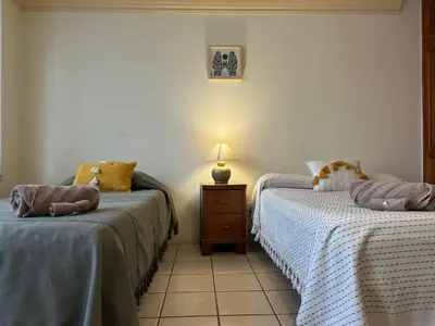 Cama o camas de una habitación en Casa Ritual tu refugio con jardín & 4 recámaras