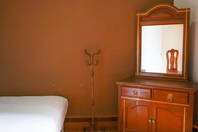 Cama o camas de una habitación en OYO Hotel El Conquistador