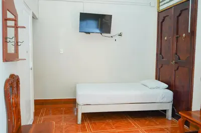 Cama o camas de una habitación en OYO Hotel El Conquistador