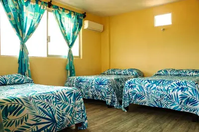 Cama o camas de una habitación en Hotel Rivera Del Mar