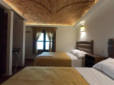 Cama o camas de una habitación en Hotel Santa Irene