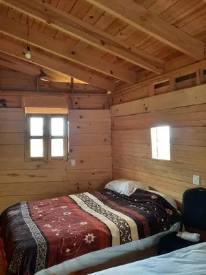 Cama o camas de una habitación en Cabañas Tepani