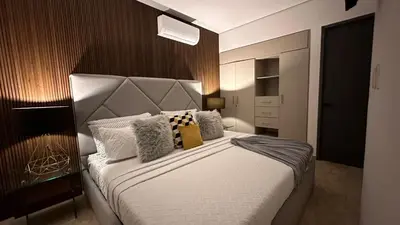 Cama o camas de una habitación en Departamento frente a la bahía