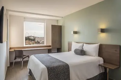 Cama o camas de una habitación en One Coatzacoalcos Forum