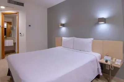 Cama o camas de una habitación en One Coatzacoalcos Forum