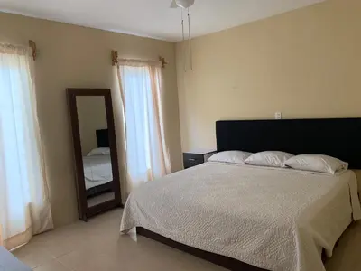Cama o camas de una habitación en Departamento completo, cómodo y cerca del aeropuerto