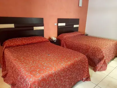 Cama o camas de una habitación en Hotel Posada Del Parque