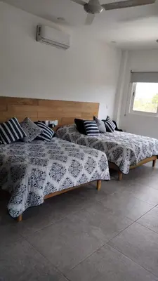 Cama o camas de una habitación en Residencial San Agustin Huatulco