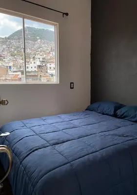 Cama o camas de una habitación en Casa céntrica con garaje
