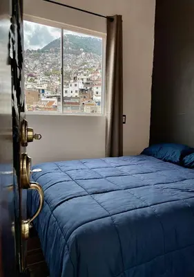Cama o camas de una habitación en Casa céntrica con garaje