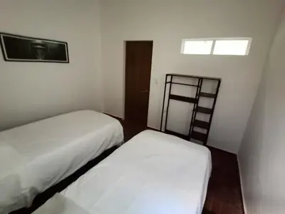 Cama o camas de una habitación en Residencial Oaxaca Centro