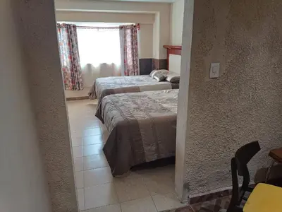 Cama o camas de una habitación en Departamento Aeropuerto CDMX