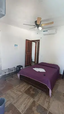 Cama o camas de una habitación en Casa Rústica, Sofía, Frente al mar en Puerto Arista