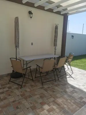 Un patio o zona al aire libre en Hermosa Casa Alberca Climatizada por Paneles Solares