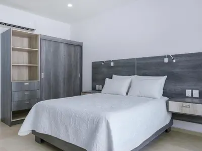 Cama o camas de una habitación en Casa Xtao Hotel