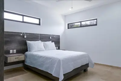 Cama o camas de una habitación en Casa Xtao Hotel