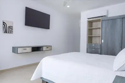 Una televisión o centro de entretenimiento en Casa Xtao Hotel