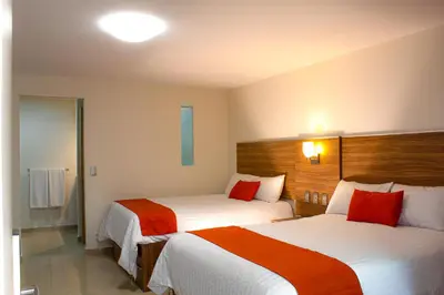 Cama o camas de una habitación en La Casa del Reloj - Zona de Hospitales