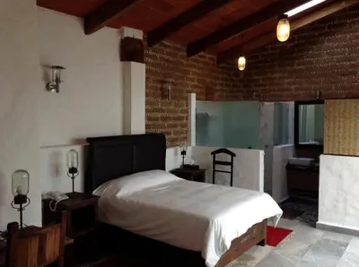 Cama o camas de una habitación en Rústika SPA Hotel Boutique