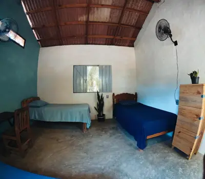 Cama o camas de una habitación en Cabañas La Escondida Mazunte