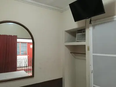 Una televisión o centro de entretenimiento en Hotel Xalapa