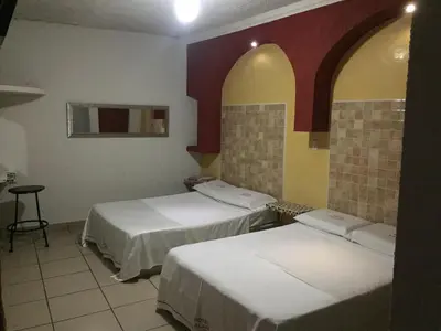 Cama o camas de una habitación en Hotel Xalapa