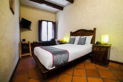 Cama o camas de una habitación en Collection O Al otro lado del rio, Puebla