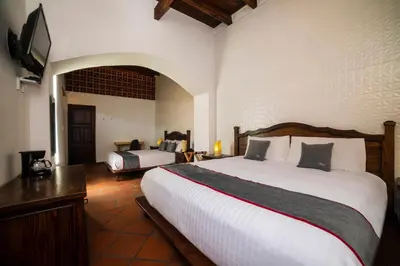 Cama o camas de una habitación en Collection O Al otro lado del rio, Puebla