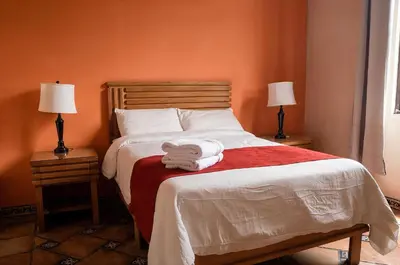 Cama o camas de una habitación en Hotel Integra Tepoztlán