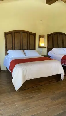 Cama o camas de una habitación en Cabañas La Cascada