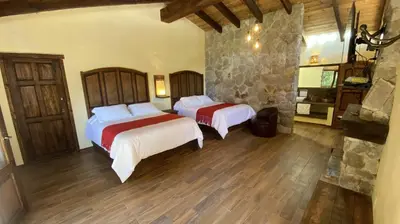 Cama o camas de una habitación en Cabañas La Cascada