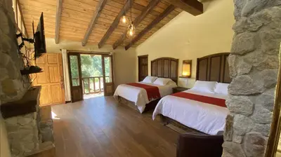 Cama o camas de una habitación en Cabañas La Cascada