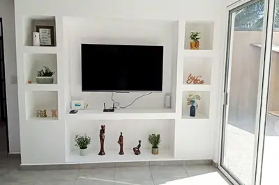 Una televisión o centro de entretenimiento en Villa De Santos Acapulco Playa Bonfil Alberca