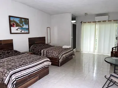 Cama o camas de una habitación en Teques inn