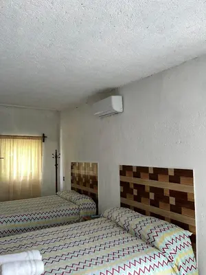 Cama o camas de una habitación en Teques inn