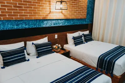 Cama o camas de una habitación en Hotel Casa Puga