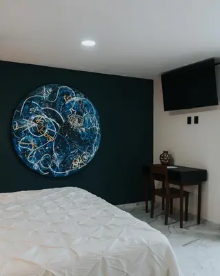 Cama o camas de una habitación en Hotel Casa Puga