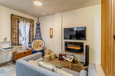 Una televisión o centro de entretenimiento en Cipressi Lofts Val'Quirico